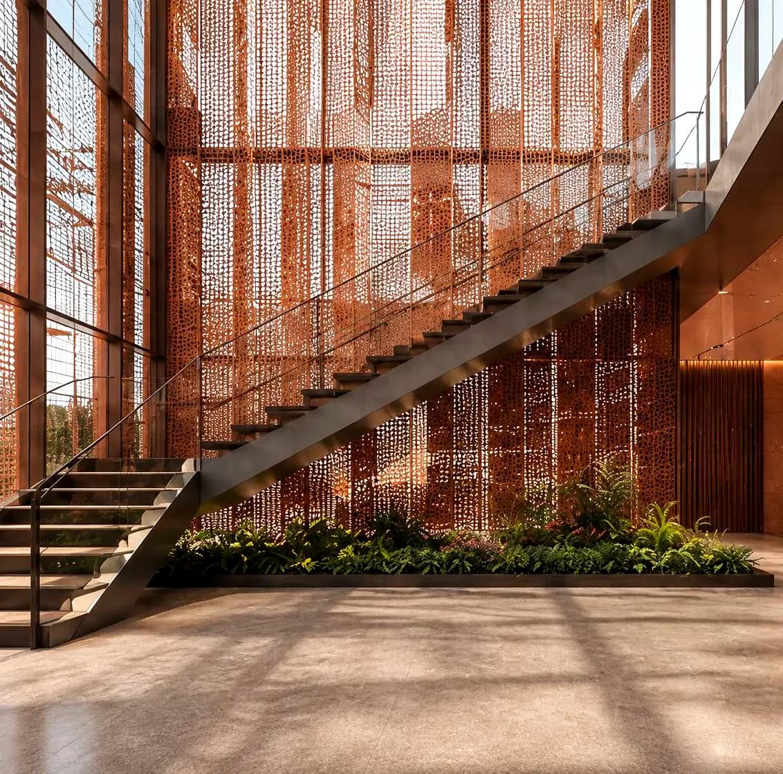 Atrium staircase with copper screen at RIFTARA Al Aqeeq